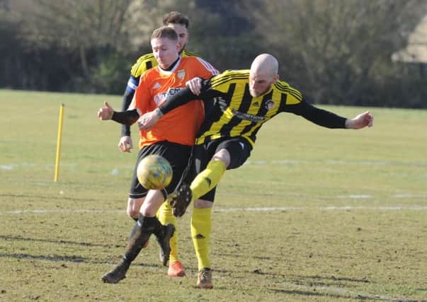 Action from Thorney (orange) v Holbeach United Reserves in the semi-final of the President's Shield. Photo: David Lowndes.