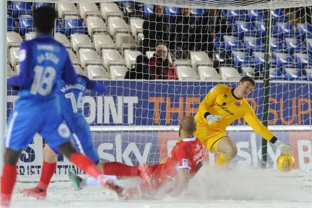 Walsall 'keeper Liam Roberts pulls off a great late save to thwart Posh striker Jack Marriott. Photo: David Lowndes.
