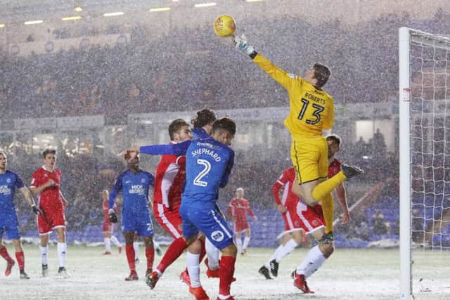 Walsall 'keeper Liam Roberts punches the ball clear. Photo: Joe Dent/theposh.com.