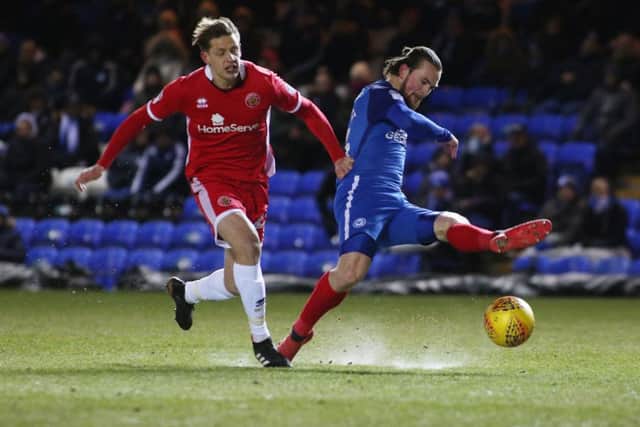 Posh striker Jack Marriott is fouled by Walsall's Jack Fitzwater to win a penalty. Photo: Joe Dent/theposh.com.