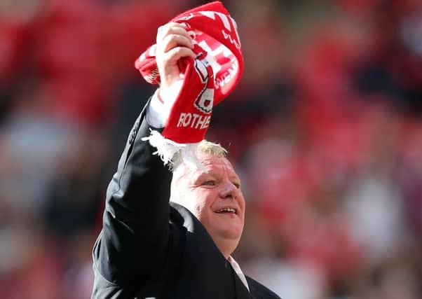 Steve Evans celebrates winning promotion from League One with Rotherham at Wembley.