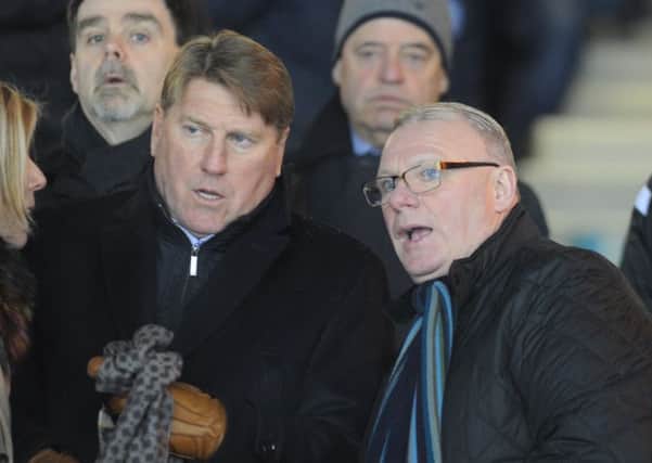 New Posh boss Steve Evans (right) and his assistant Paul Raynor watch the 2-1 win over Walsall. Photo: David Lowndes.