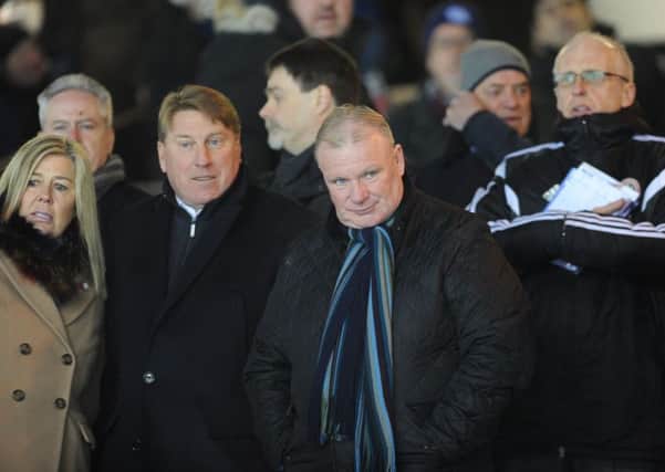 Steve Evans (right) watching Posh beat Walsall. Photo: David Lowndes.