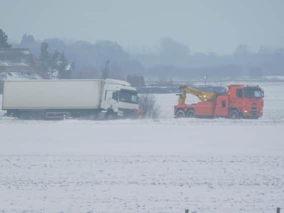 A HGV being towed away