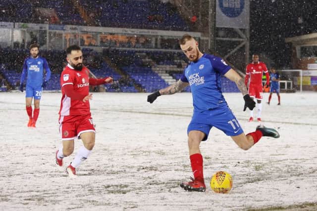 Marcus Maddison in action for Posh.