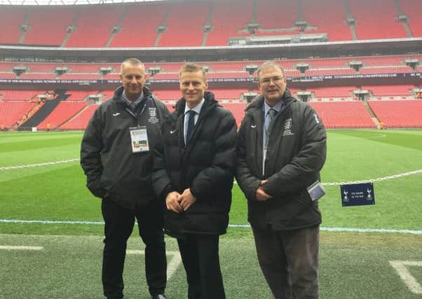 Neil Smith (left) pictured pitchside at Wembley with Mike Jones and Rob Windle (right). Picture: RWT Photography