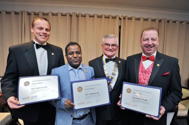 Simon Fitton, Abdul Bashir and Mark Crofts presented with "Paul Harris Fellows" awards from  Alan Eldred, president of Peterborough Minster Rotary Club , at Milton Golf Club EMN-180223-162755009