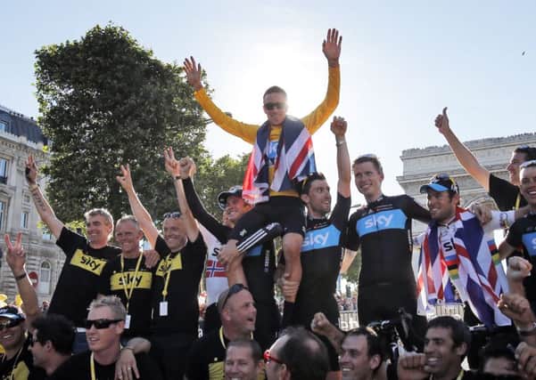 Bradley Wiggins celebrates his 2012 Tour de France victory.