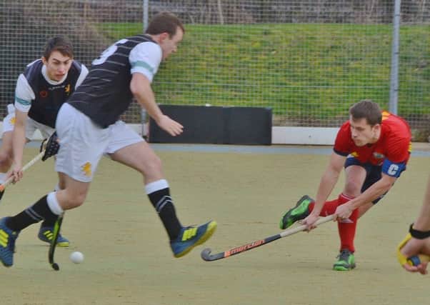 City of Peterborough skipper Ross Booth (red) in action.