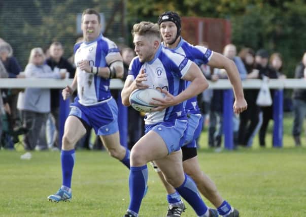 Will Carrington attacks for the Lions the last time they beat Scunthorpe in October 2014. Supporting him are Adam Barnard and Reggie Reid. Picture: Mick Sutterby