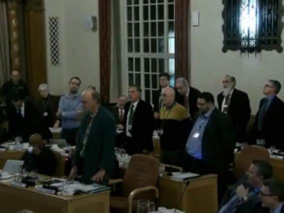 Opposition members show their disapproval after a second vote is called. Photo: Peterborough City Council