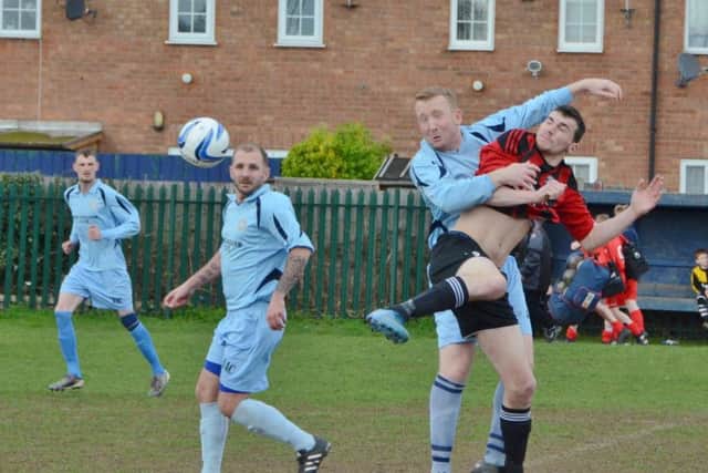 Peterborough NECI (blue) in action.