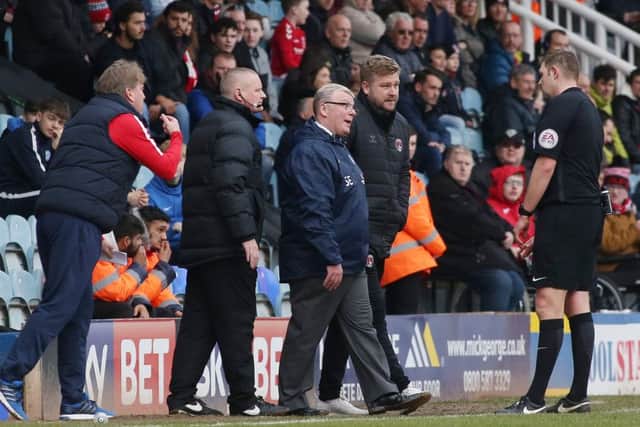 Posh manager Steve Evans is spoken to by match referee Brett Huxtable during the big win over Charlton. Photo: Joe Dent/theposh.com.