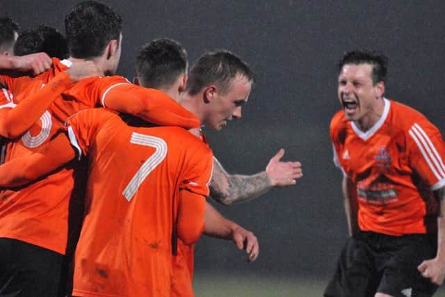 Yaxley players celebrate their goal at Deeping. Photo: Tim Wilson.