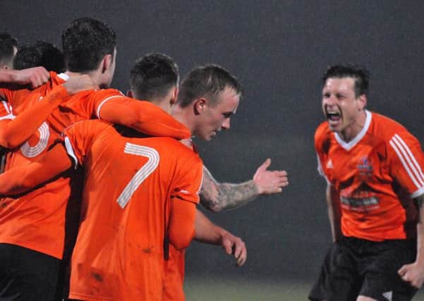 Yaxley players celebrate their goal at Deeping. Photo: Tim Wilson.