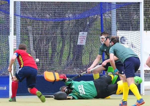 Ross Booth (red) opens the scoring for City of Peterborough against Letchworth. Photo: David Lowndes.