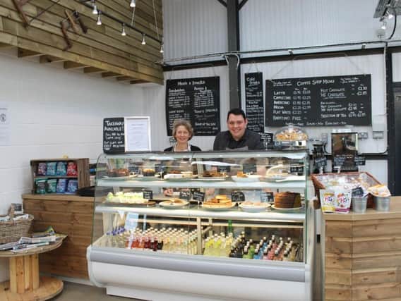 Harvest Barn owner Lynn Briggs and Ashley Holland, assistant manager, in the new farm shop.