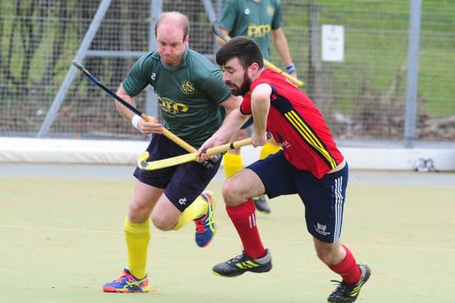 Ben Newman (red) in action for City of Peterborough. Photo: David Lowndes.