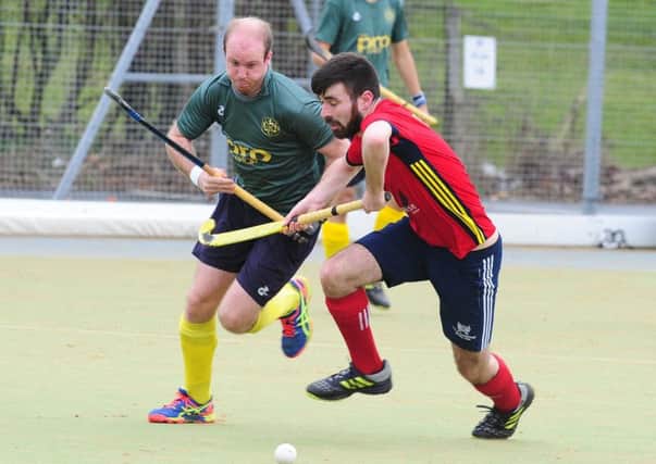 Ben Newman (red) in action for City of Peterborough. Photo: David Lowndes.