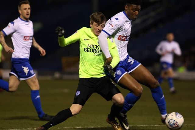 Posh midfielder Chris Forrester battles for possession with Bury's Rohan Ince. Photo: Joe Dent/theposh.com.