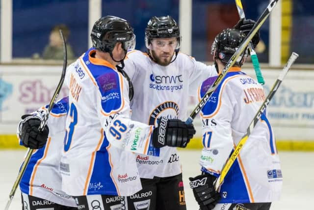 Tom Norton (centre) scored Phantoms first goal against Streatham.