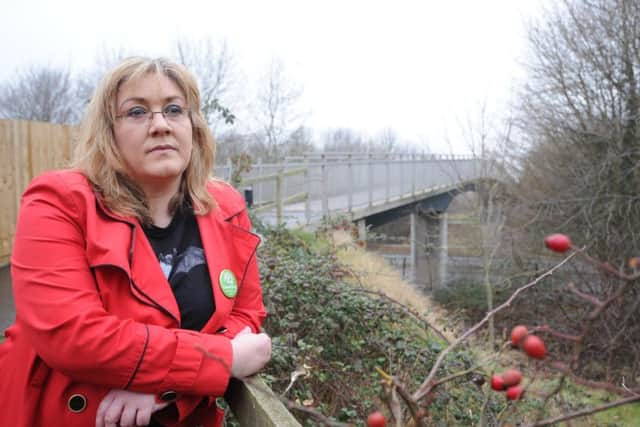 Orton Northgate where car theft is prolific  -  Coun Julie Howell at the bridge will allows access to the estate. EMN-180901-215127009