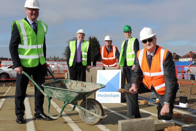 The laying of the first brick