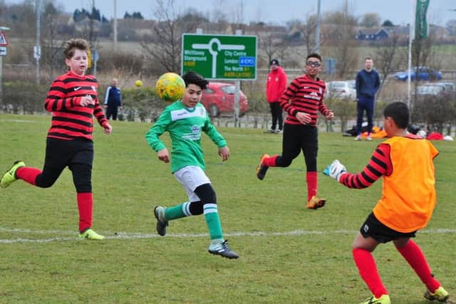Action from the game between Park Farm Pumas Black Under 13s and FC Peterborough.