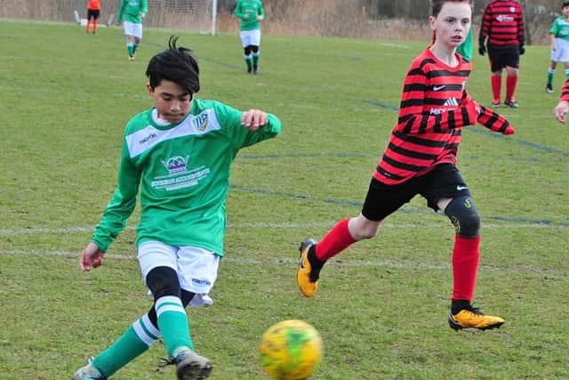 Action from the game between Park Farm Pumas Black Under 13s and FC Peterborough.