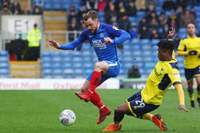 Posh substitute Danny Lloyd skips past Oxford's Ashley Smith-Brown. Photo: Joe Dent/theposh.com