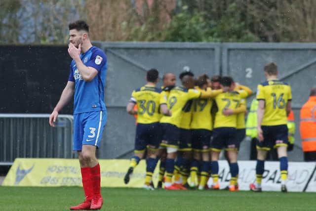 Oxford players celebrate their second goal against Posh behind Andrew Hughes. Photo: Joe Dent/theposh.com