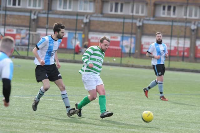 Action from Premiair v Eye (green) in the semi-final of the Intermediate Shield. Photo: David Lowndes.