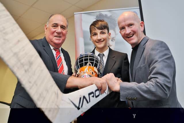 Peterborough SportsAid chief Phil Elmer (left) with Luke Clark and Eddie The Eagle Edwards.