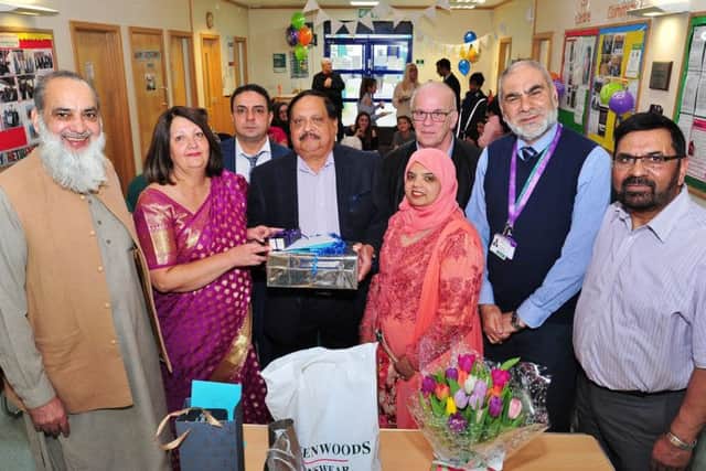 Retirement presentation to GP Dr  Swaminathan Srinivasan at the Iqbal Centre together with some of the guests at the event EMN-181003-174538009
