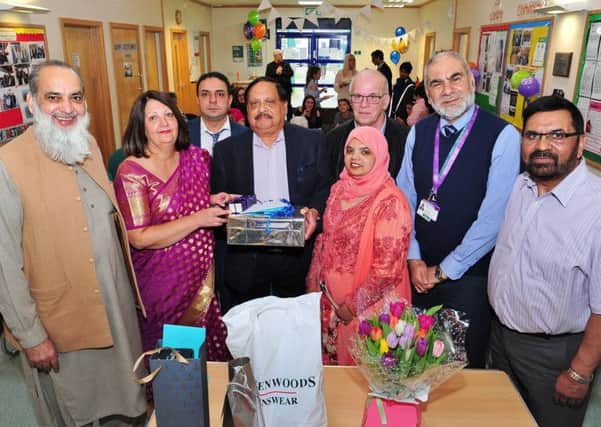 Retirement presentation to GP Dr  Swaminathan Srinivasan at the Iqbal Centre together with some of the guests at the event EMN-181003-174538009