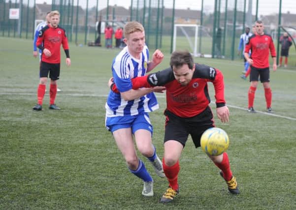 Ben Daly (red) will be a key man for Netherton United as they seek their first Peterborough Premier Division title.