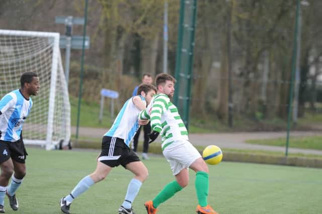 Action from the abandoned semi-final between Eye United (green) and Premiair. Photo: David Lowndes.