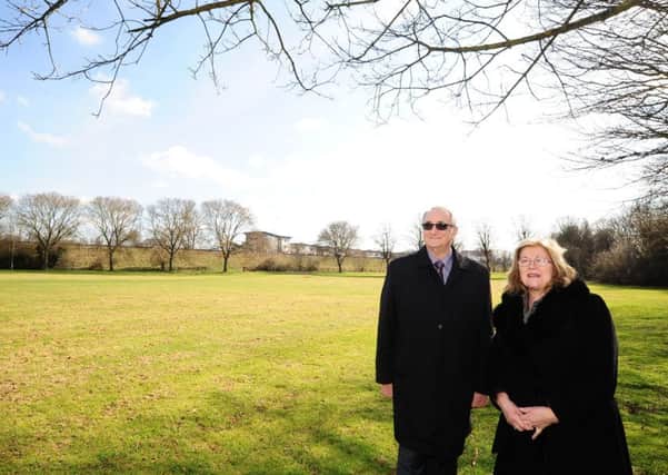 Peterborough City Council  Leader Cllr John  Holdich and education cabinet member Cllr Lynne Ayres at the site of proposed University of Peterborough student accommodation at Bishop's Road EMN-180321-152923009