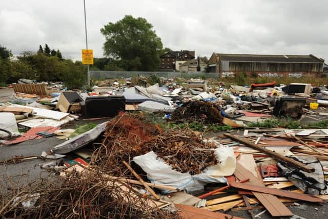 Fly tipping and rubbish dumped on the former B & Q and Matalan site on Station Road East ENGEMN00120131014132052