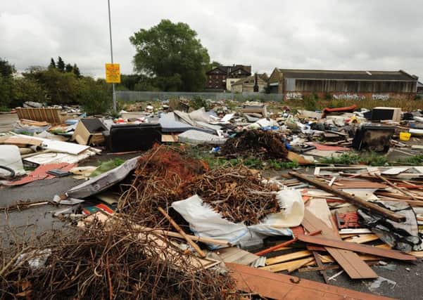 Fly tipping and rubbish dumped on the former B & Q and Matalan site on Station Road East ENGEMN00120131014132052