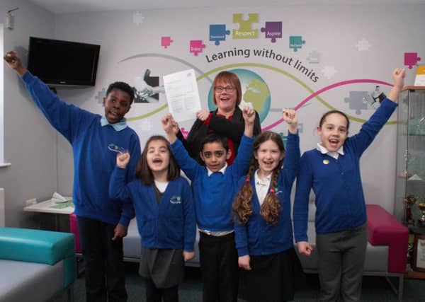 Headteacher Joanna Cook with pupils at Paston Ridings Primary School