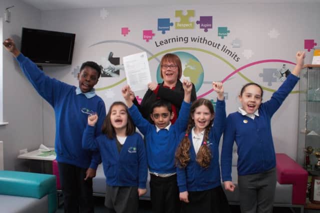Headteacher Joanna Cook with pupils at Paston Ridings Primary School