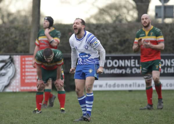 Lions scrum-half Tom Dougherty roars with delight on the final whistle at Sandbach. Picture: Mick Sutterby