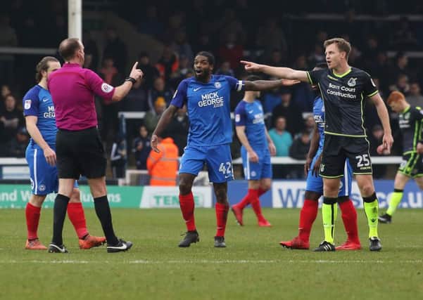 Posh skipper Anthony Grant is involved in an argument with referee Carl Boyeson during the 1-1 draw with Bristol Rovers. Photo: Joe Dent/theposh.com.