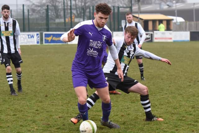 Wayne Morris (stripes) of Peterborough Northern Star in action against Daventry Town. Photo: Chantelle McDonald. @cmcdphotos.