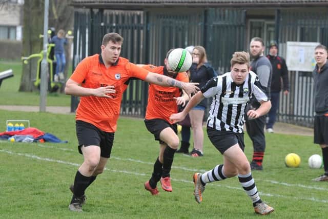 Action from the PFA Junior Cup semi-final between Brotherhood Sports and Oundle Town Reserves (stripes). Photo: David Lowndes.