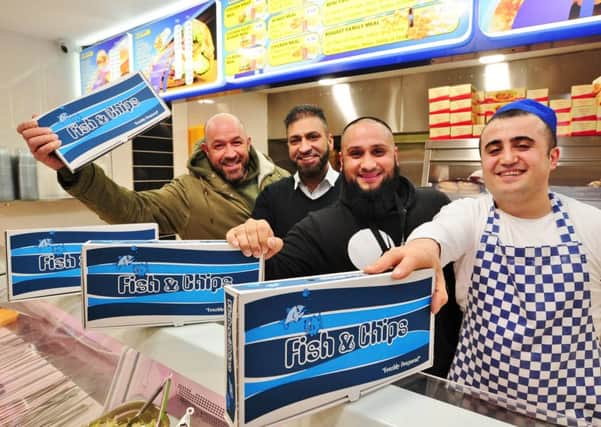 Boxing gym owner  Vic Imbriano (who paid for 50 meals for the homeless from funds from his latest boxing show) with Waheed Fazal and Atiq Rehman from Children of Adam and Ceyhun Dilek from Rumbles Fish Bar at Werrington EMN-180322-213544009