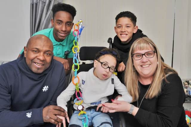 Former Posh player Trevor Quow with wife Michelle, son Dion (11) and nephew Lequahn Quow (15) and Jada-Lea who is in need of special equipment to help with her illness. EMN-180326-214814009