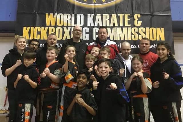 Hicks Karate School team at the national championships. From the left they are, back, Atlanta Hickman, Rahim Ebrahim (coach), James Doyle (coach), David Prior, Andrew Hicks (chief instructor, middle,  Denas Jankauskas, Warren Bothamley, Sophie Doyle, Joshua Leonard, Sophie Hicks, Oliver Profitt , Craig Leonard (coach), Tomas Butvilas, front, Raihan Ebrahim, Aaron Leonard, Lucy Hicks and Elise Ward.
