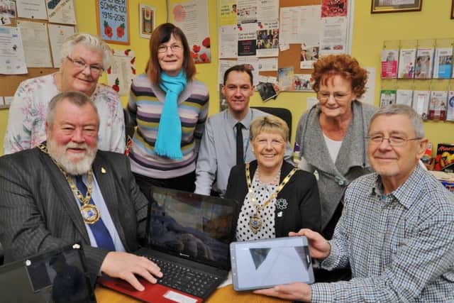 Mayor of Peterborough Coun. John Fox and Mayoress Judy Fox with  PCC digital inclusion officer Matthew Beckett and visitors to the Senior Stop centre learning about IT EMN-180320-163747009